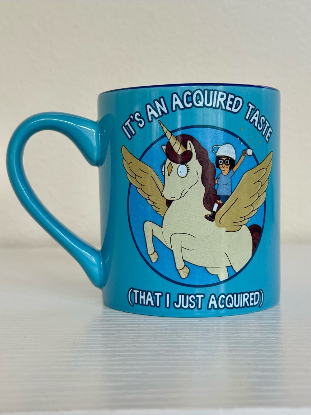 Silver Buffalo Bob's Burgers Tina Unicorn Acquired Taste Ceramic Mug, 14-Ounce